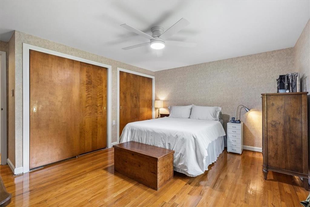 1220 Rolling Meadow Road Pittsburgh, PA 15241 - Photo 25 of 46 a spacious bedroom with a bed and wooden floor