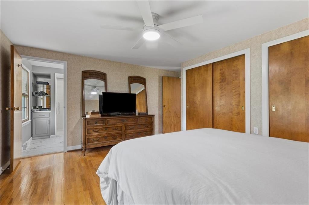 1220 Rolling Meadow Road Pittsburgh, PA 15241 - Photo 26 of 46 a bedroom with a bed and a flat screen tv