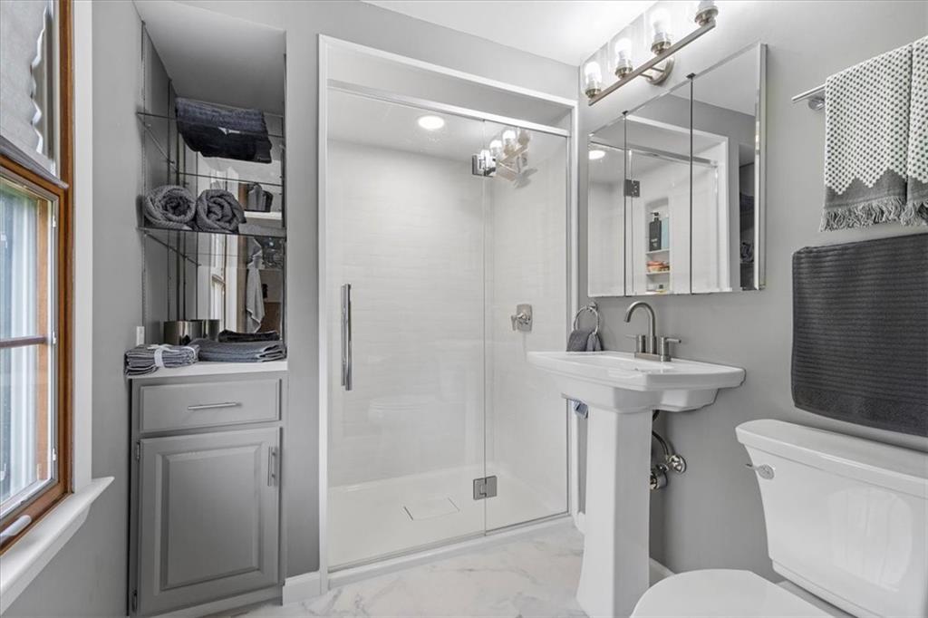 1220 Rolling Meadow Road Pittsburgh, PA 15241 - Photo 27 of 46 a bathroom with a sink a toilet and shower