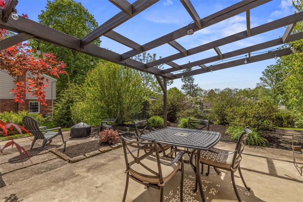 1220 Rolling Meadow Road Pittsburgh, PA 15241 - Photo 36 of 46 a view of patio with a table and chairs and potted plants