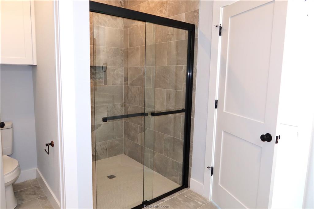 2004 Reagan Court Bryan, TX 77802 - Photo 12 of 19 a bathroom with a shower