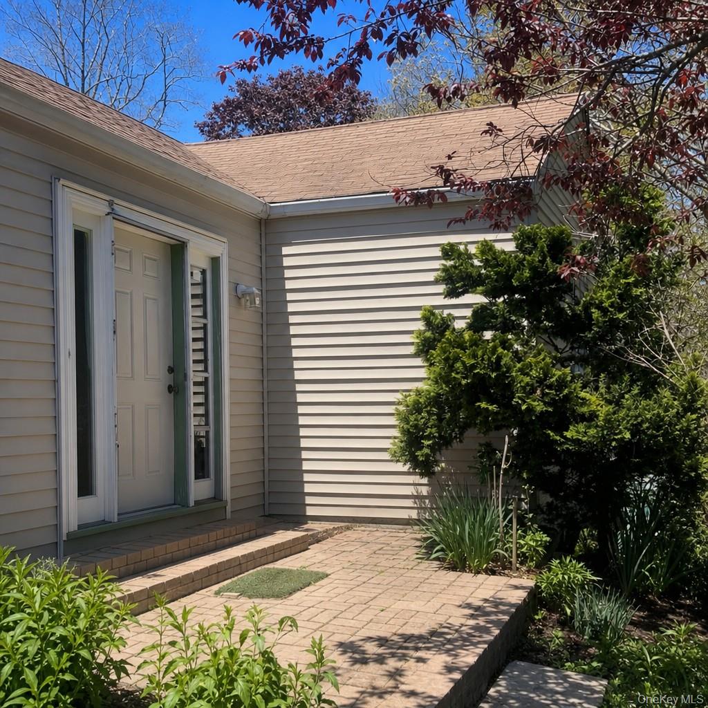 719 North Sea Road Southampton, NY 11968 - Photo 1 of 6 a view of house with backyard and sitting space