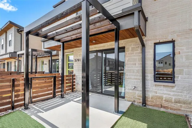 a view of a building with a door and balcony