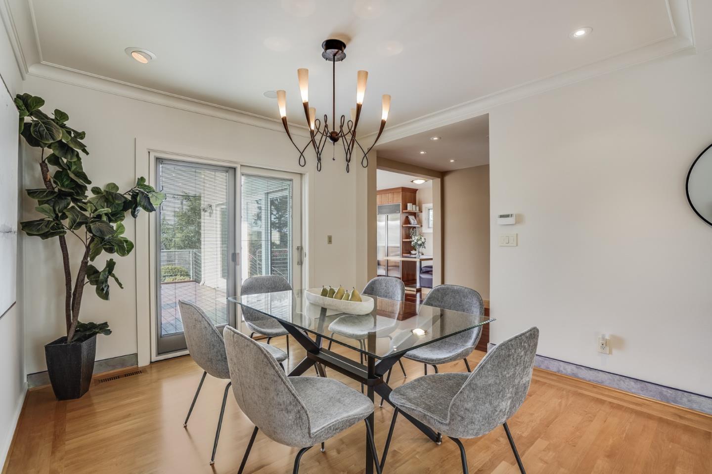 4001 Marshall Avenue San Mateo, CA 94403 - Photo 24 of 88 a view of a dining room with furniture and a chandelier