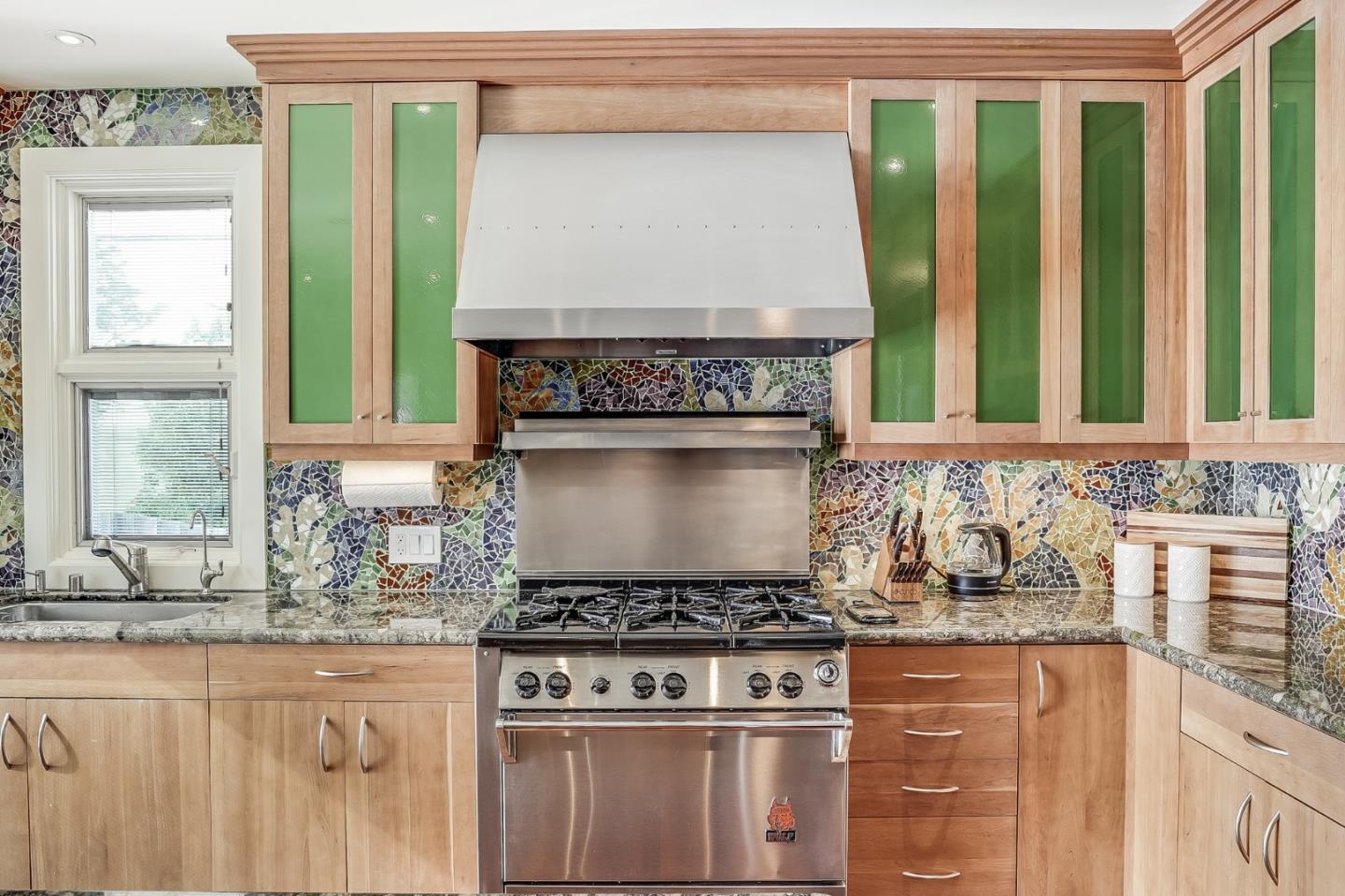 4001 Marshall Avenue San Mateo, CA 94403 - Photo 34 of 88 a kitchen with granite countertop a stove and a sink