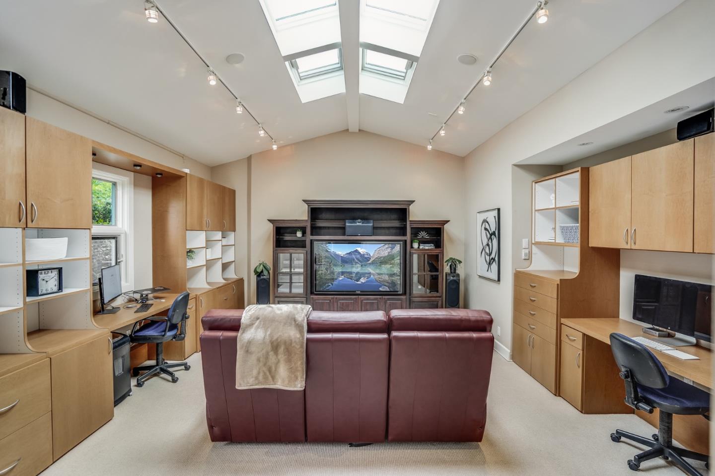 4001 Marshall Avenue San Mateo, CA 94403 - Photo 53 of 88 a living room with furniture a fireplace and a flat screen tv