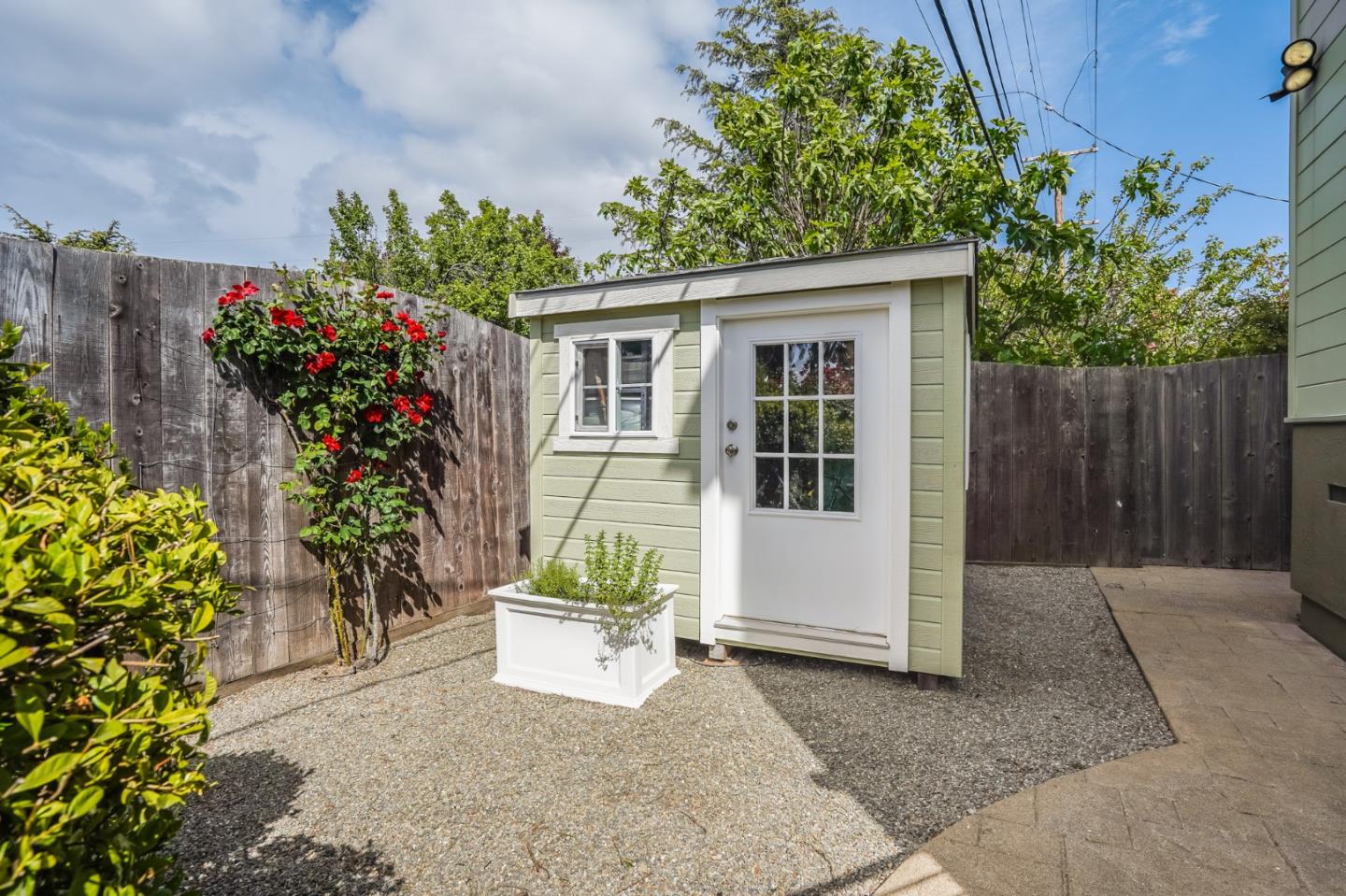 4001 Marshall Avenue San Mateo, CA 94403 - Photo 61 of 88 a house with a yard and potted plants