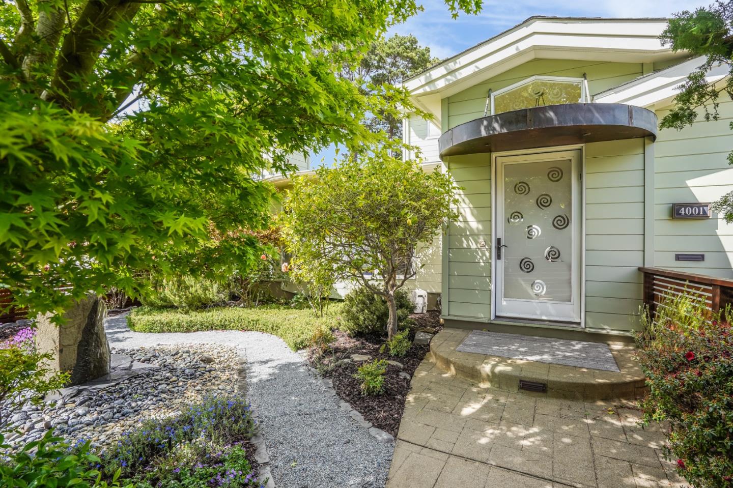 4001 Marshall Avenue San Mateo, CA 94403 - Photo 7 of 88 a front view of a house with garden