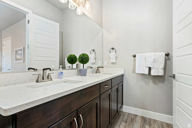 2600 Ocotillo Way, Unit 31 Santa Clara, UT 84765 - Photo 22 of 73 Bathroom featuring a dual vanity with light-colored countertops, dark wood-finish cabinetry, and brushed nickel fixtures
