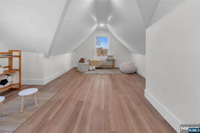 a room with wooden floor and furniture