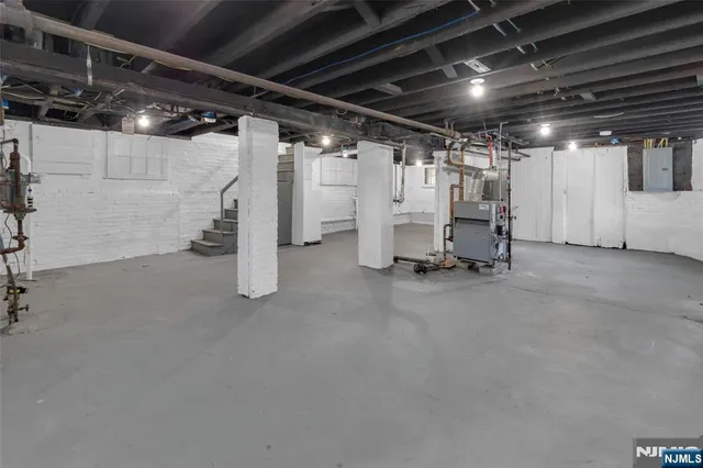 a view of empty room with wooden ceiling