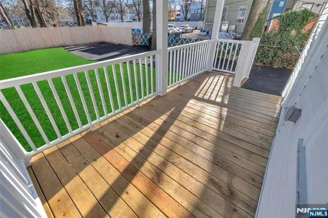 a view of balcony with wooden floor