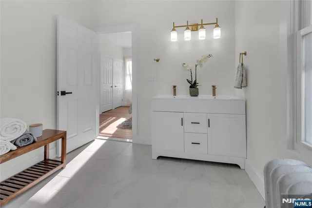 a view of a hallway view with staircase