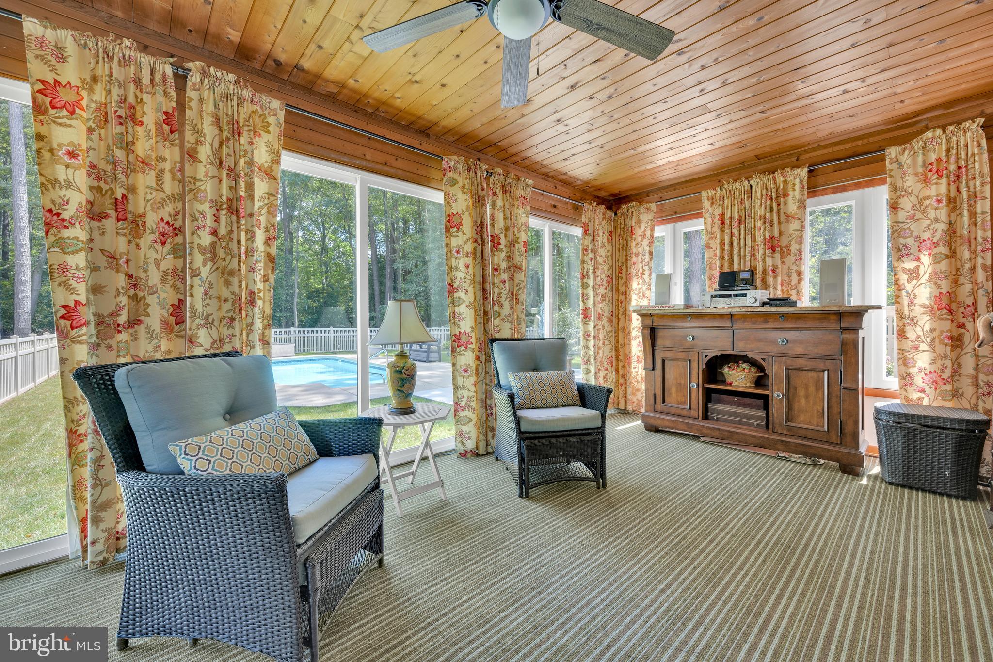 292 Pond Road Millsboro, DE 19966 - Photo 21 of 66 a living room with furniture and a fireplace