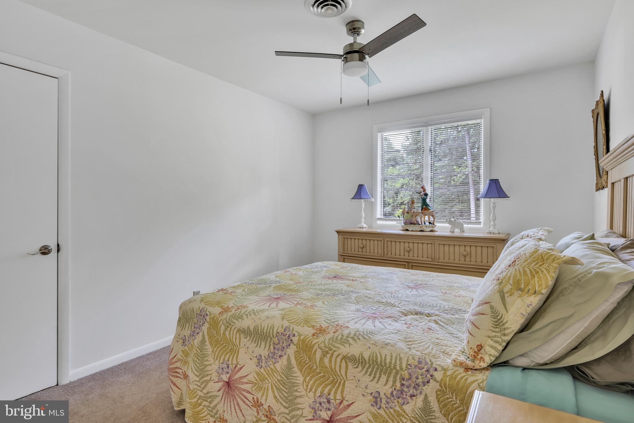 292 Pond Road Millsboro, DE 19966 - Photo 34 of 66 a bedroom with a bed and window