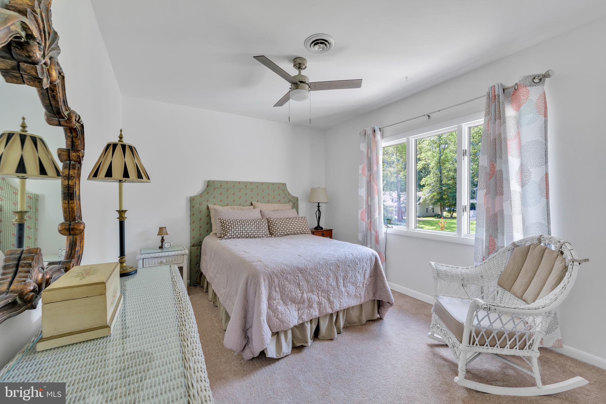 292 Pond Road Millsboro, DE 19966 - Photo 36 of 66 a bedroom with a bed chairs and window