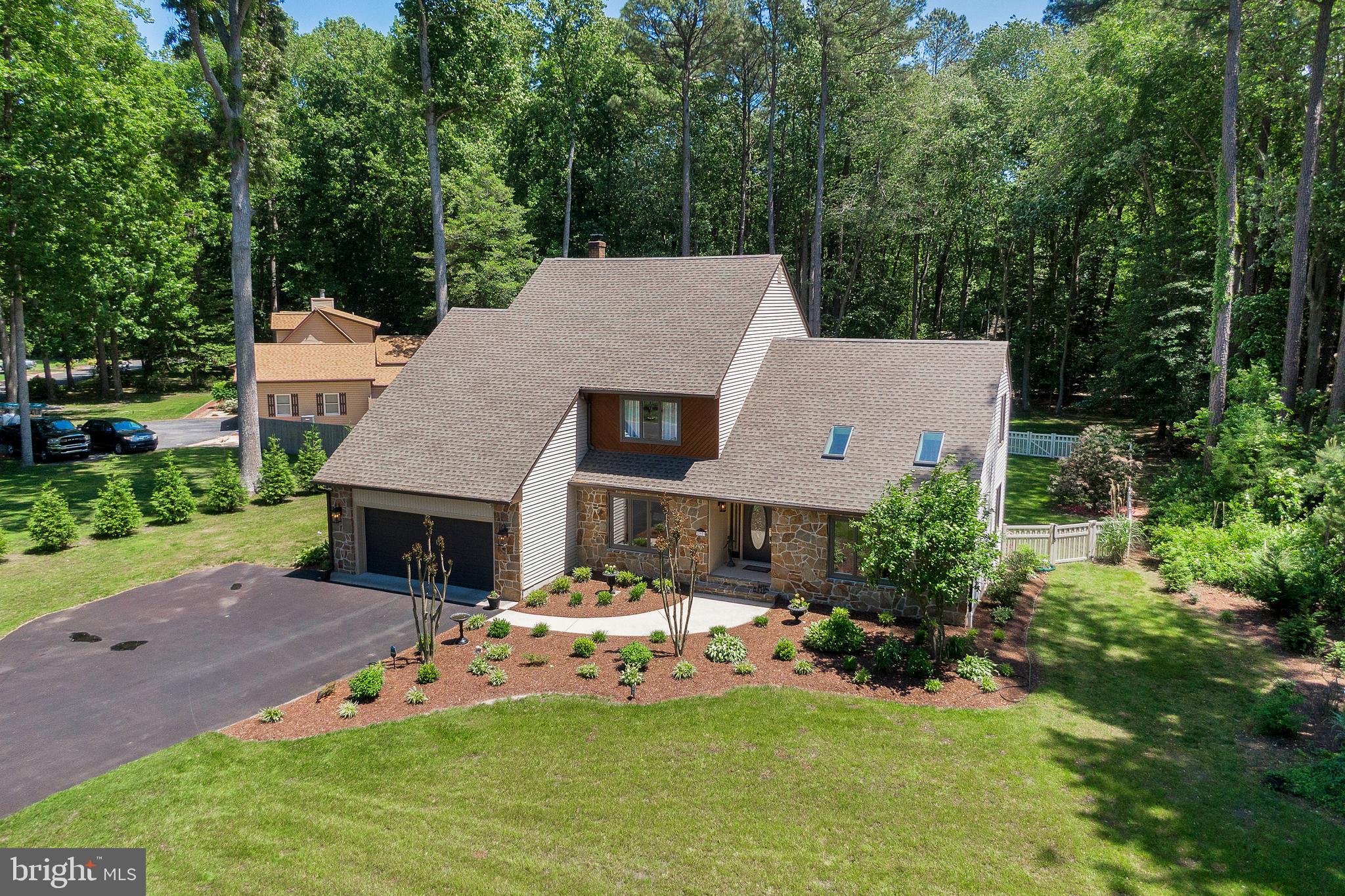 292 Pond Road Millsboro, DE 19966 - Photo 53 of 66 a aerial view of a house with swimming pool and a yard