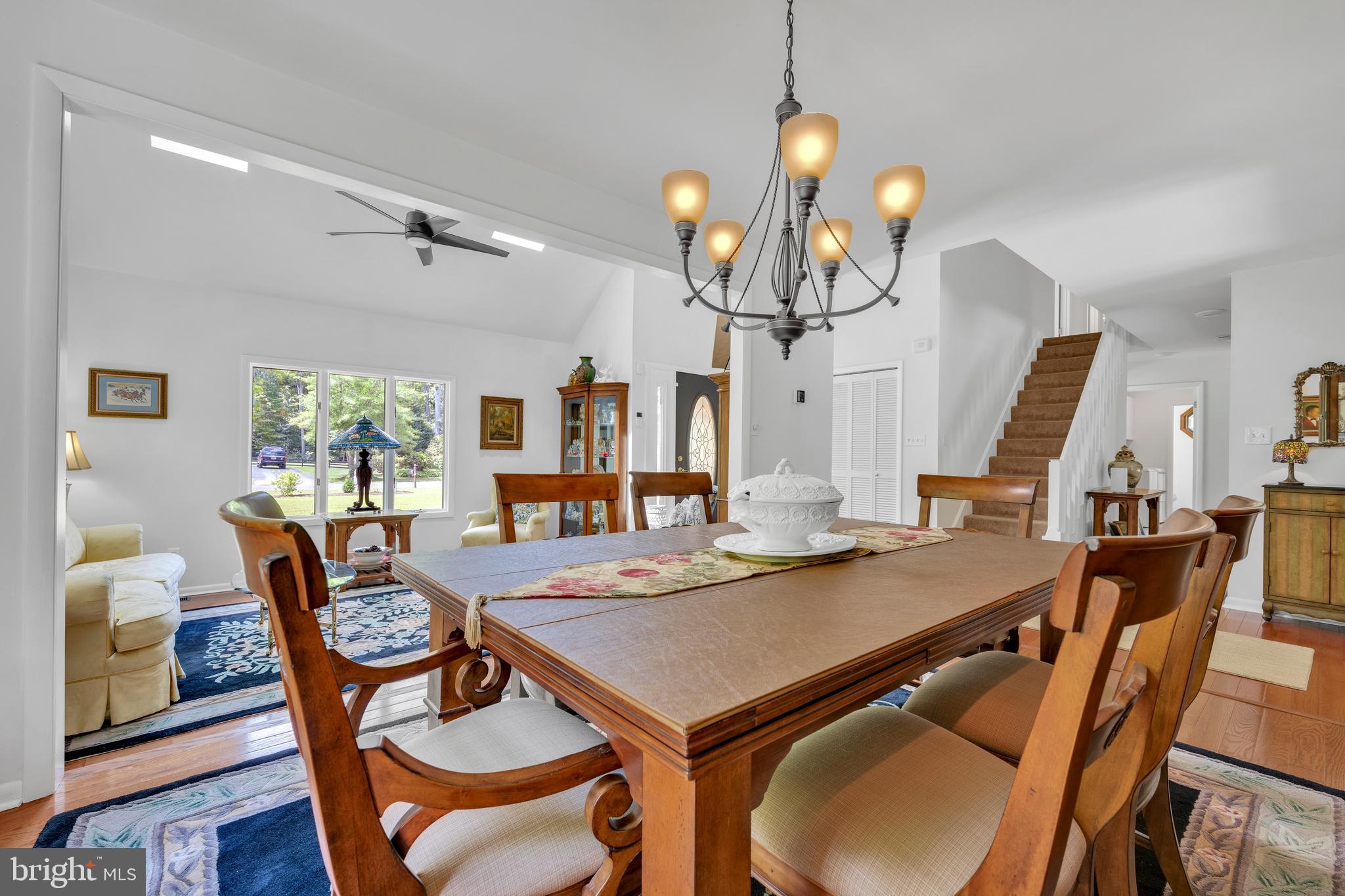 292 Pond Road Millsboro, DE 19966 - Photo 7 of 66 a view of a dining room with furniture window and wooden floor