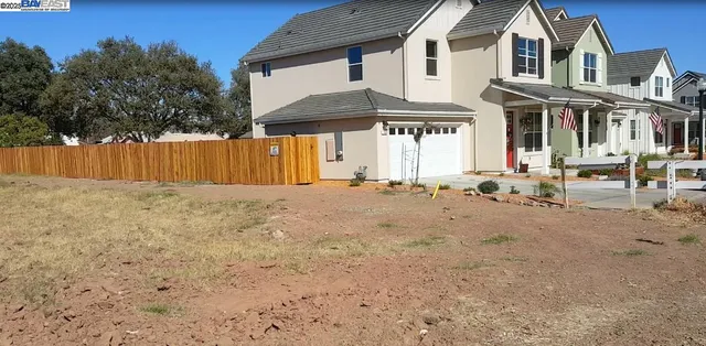 a front view of a house with a outdoor space