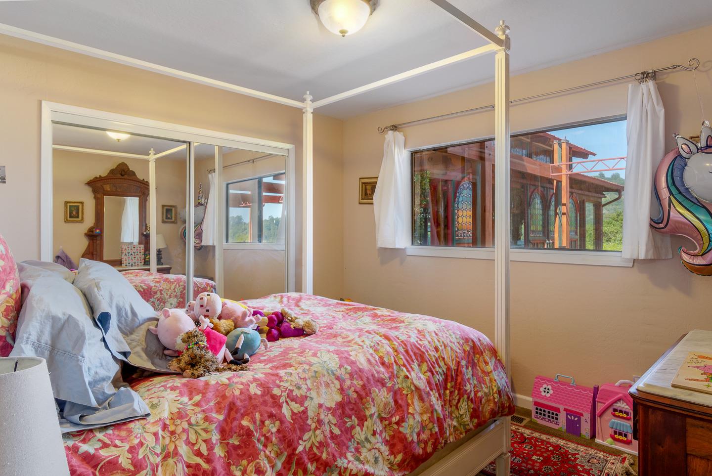 260 Rancho Soquel Drive Soquel, CA 95073 - Photo 21 of 41 a bedroom with a bed and wooden floor