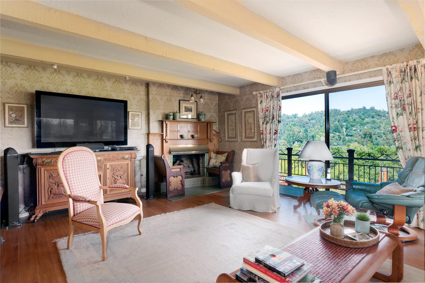 260 Rancho Soquel Drive Soquel, CA 95073 - Photo 6 of 41 a living room with furniture a flat screen tv and a floor to ceiling window