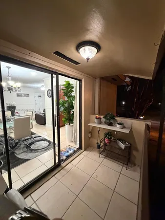 a view of a swimming pool and outdoor kitchen