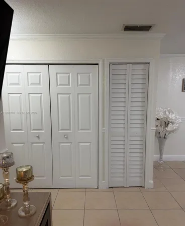 a view of entryway with cabinet