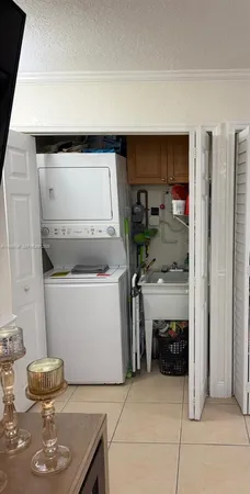 a utility room with washer and dryer