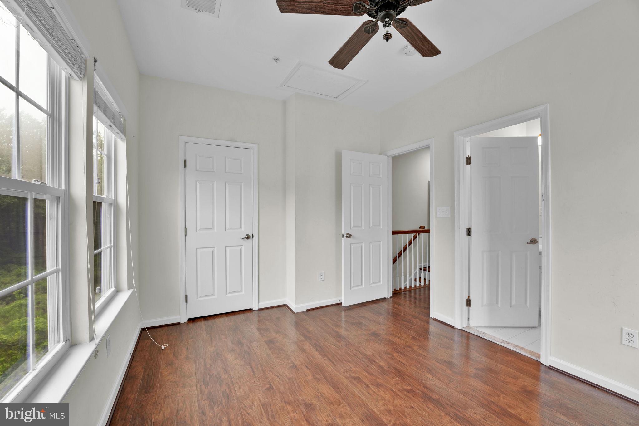 7138 Station House Road Elkridge, MD 21075 - Photo 9 of 42 a view of empty room with wooden floor and window