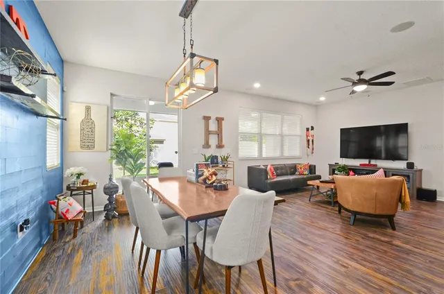 a view of a dining room with furniture window and wooden floor