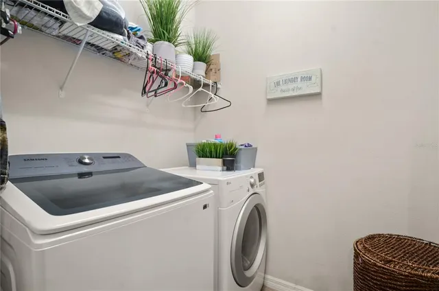 a utility room with dryer and washer