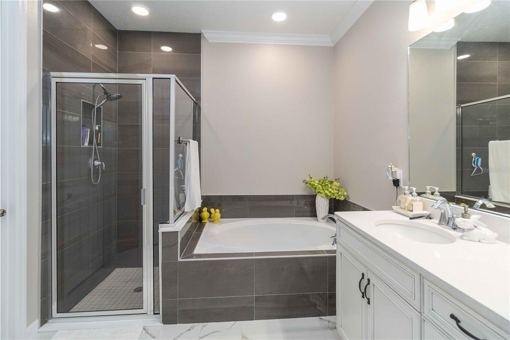 14327 Wabasso Loop Winter Garden, FL 34787 - Photo 21 of 48 a bathroom with a tub sink and mirror