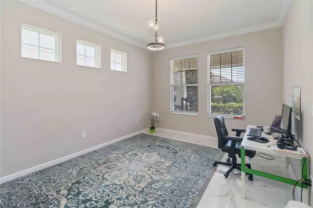 a view of a livingroom with a workspace