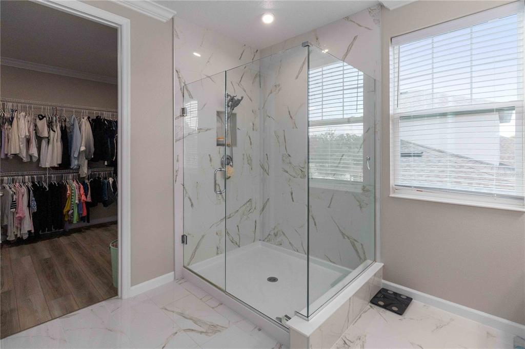 14327 Wabasso Loop Winter Garden, FL 34787 - Photo 30 of 48 a bathroom with a shower and a sink