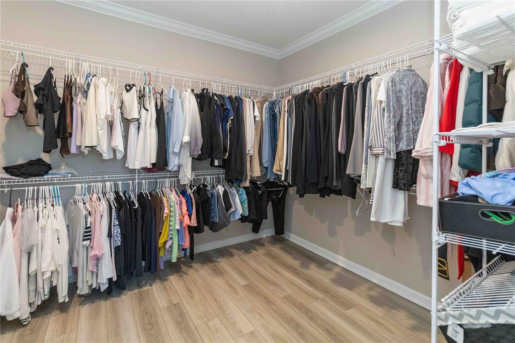 14327 Wabasso Loop Winter Garden, FL 34787 - Photo 31 of 48 a view of walk in closet with clothes