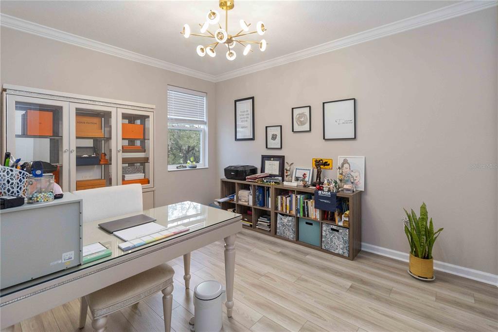 14327 Wabasso Loop Winter Garden, FL 34787 - Photo 32 of 48 a workspace with furniture window and wooden floor