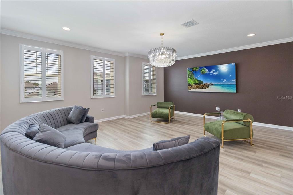 14327 Wabasso Loop Winter Garden, FL 34787 - Photo 39 of 48 a living room with furniture and a wooden floor