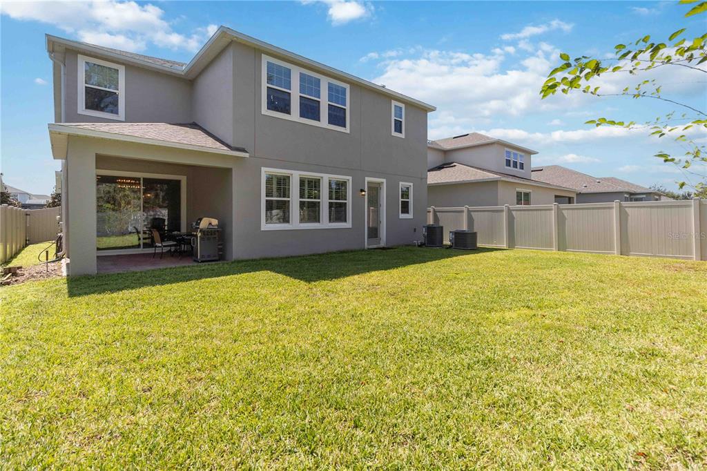 14327 Wabasso Loop Winter Garden, FL 34787 - Photo 48 of 48 a view of a house with a yard