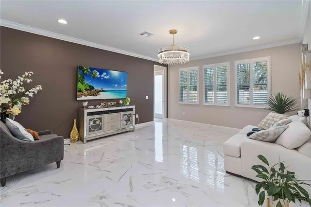 a view of a livingroom with furniture and staircase