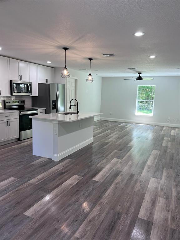 10268 North Harbor Way Citrus Springs, FL 34434 - Photo 11 of 23 a view of kitchen with sink microwave and refrigerator