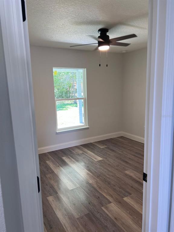 10268 North Harbor Way Citrus Springs, FL 34434 - Photo 18 of 23 a view of empty room with wooden floor