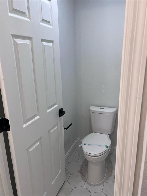 10268 North Harbor Way Citrus Springs, FL 34434 - Photo 21 of 23 a white toilet sitting next to a sink