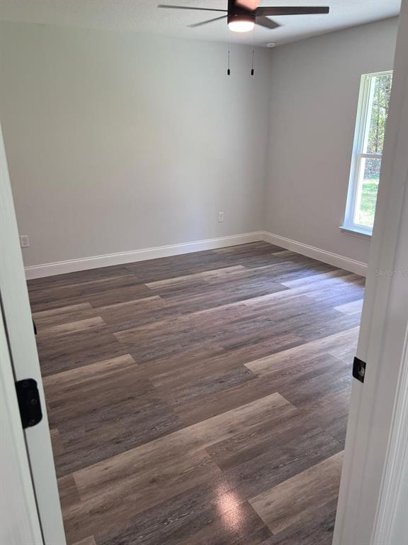 10268 North Harbor Way Citrus Springs, FL 34434 - Photo 22 of 23 a view of a room with wooden floor