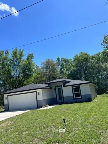 a view of a backyard of the house