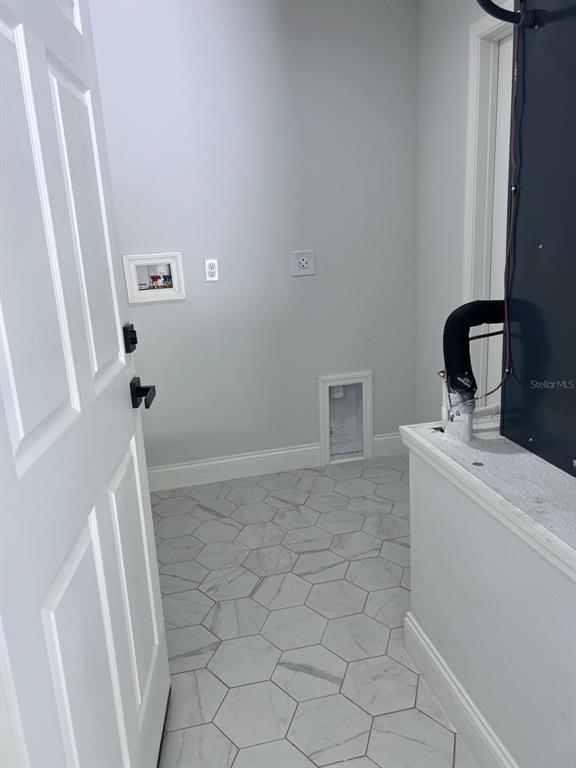 10268 North Harbor Way Citrus Springs, FL 34434 - Photo 6 of 23 a bathroom with a sink and a washing machine