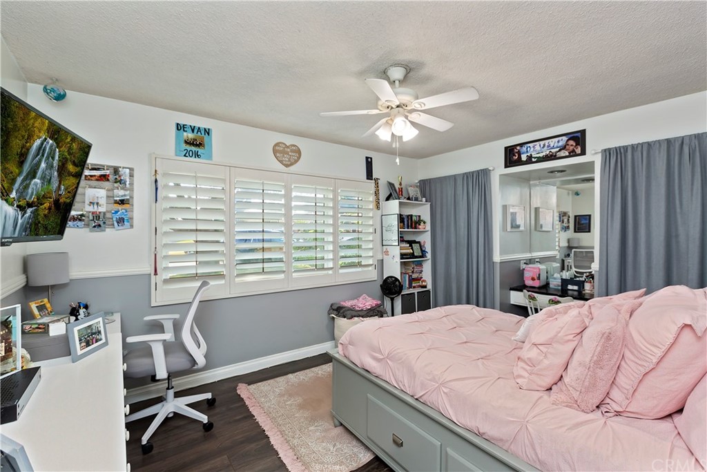 5201 Coventry Drive Riverside, CA 92506 - Photo 12 of 42 a bed room with a bed window and a flat screen tv