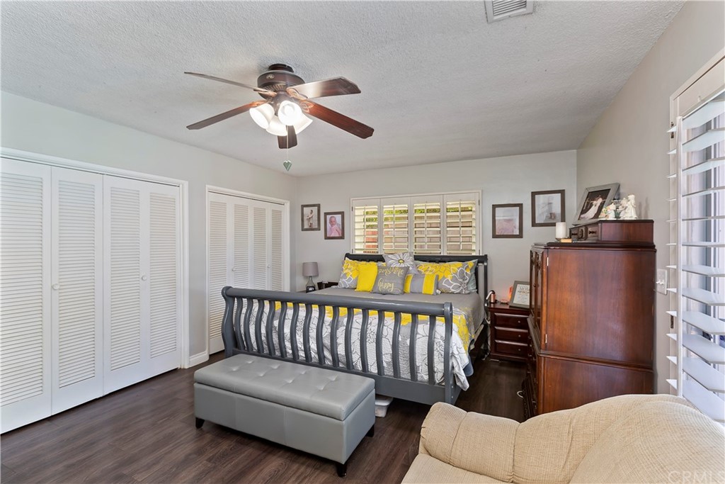 5201 Coventry Drive Riverside, CA 92506 - Photo 14 of 42 a bedroom with furniture and wooden floor