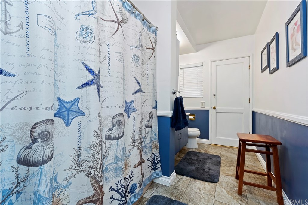 5201 Coventry Drive Riverside, CA 92506 - Photo 16 of 42 a bathroom with a bathtub and shower