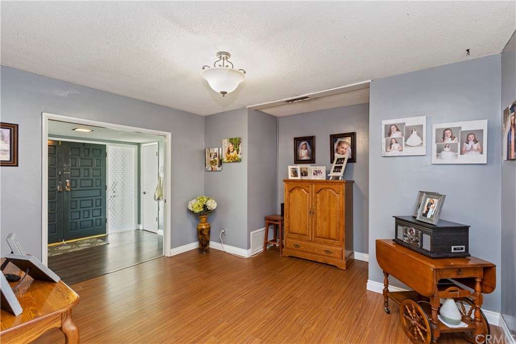 5201 Coventry Drive Riverside, CA 92506 - Photo 19 of 42 a view of a workspace with wooden floor and furniture