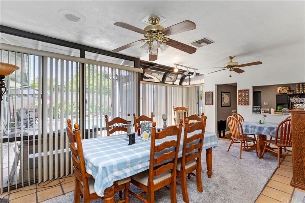 5201 Coventry Drive Riverside, CA 92506 - Photo 25 of 42 a dining room with furniture and a large window